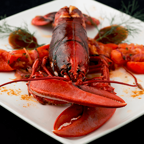 Homard bleu, jus réduit de veau, poivre de Séchuan et miel de fleurs de Champagne Famille Mary